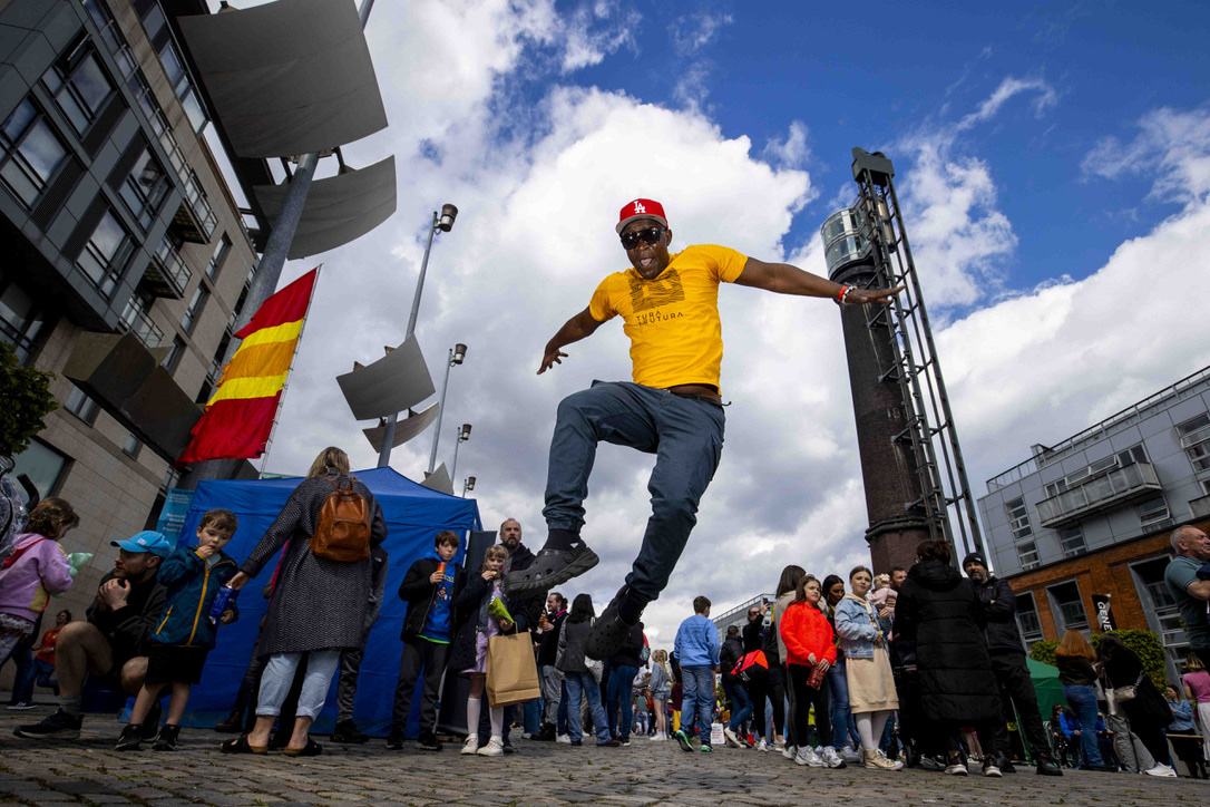 Tura Arutura leaping high above a festival crowd outside Croke Park, arms spread